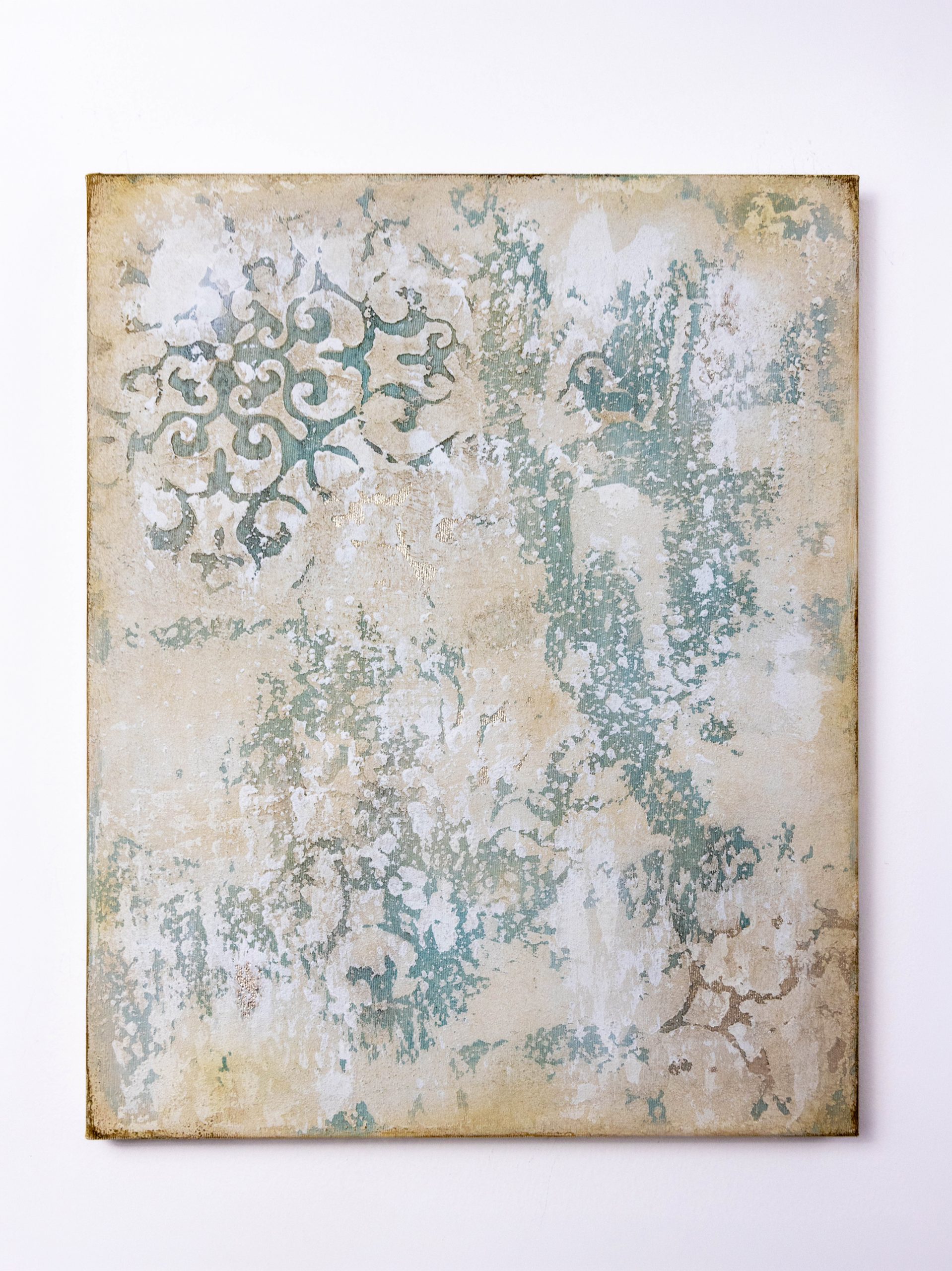 Original textured abstract canvas painting in sage green, ivory, and warm beige tones with distressed layers, faded ornamental patterns, and subtle metallic accents, 40 x 50 cm.